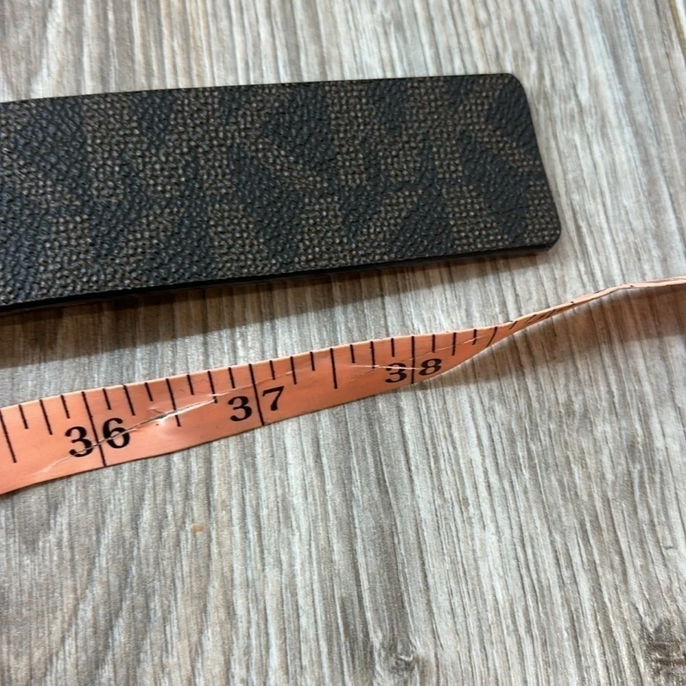 Michael Kors brown logo women belt size medium flawed with gold